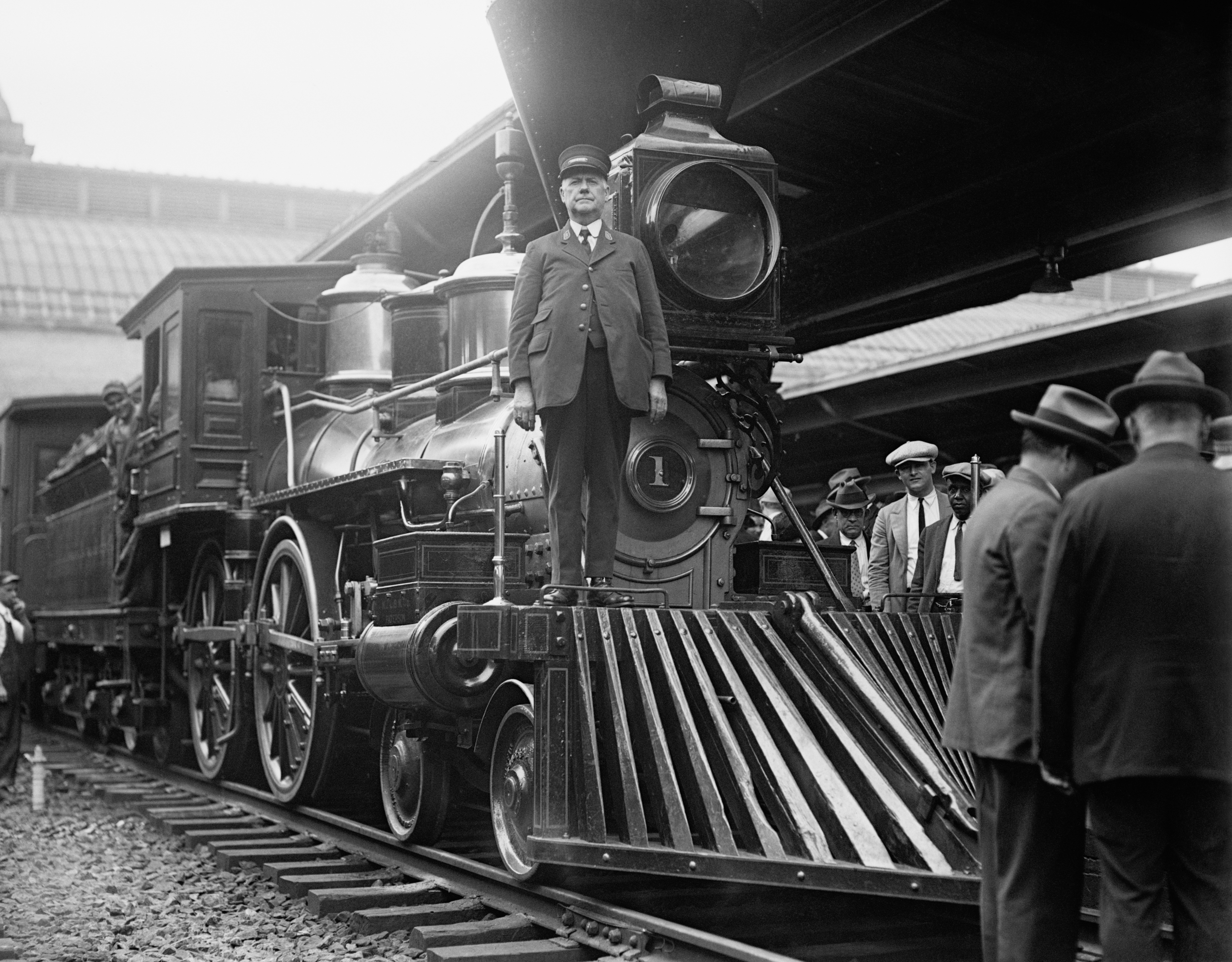 Sir William Crookes at a railway station.